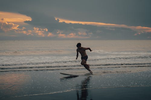 Boy Comes Back From Surfing