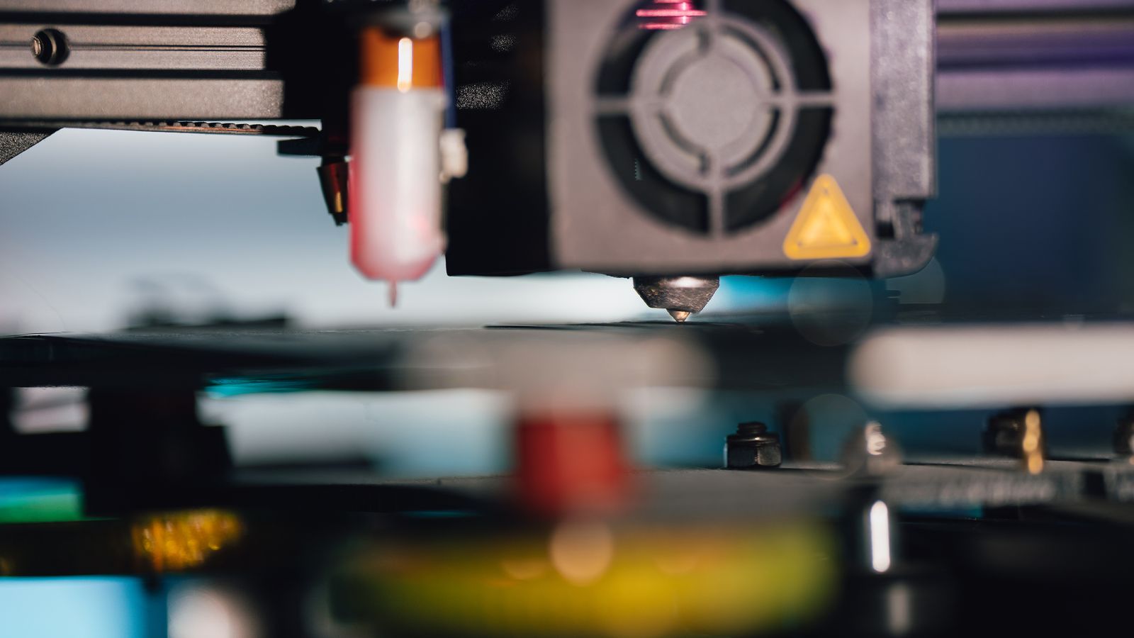 3D printer producing a batch of plastic parts