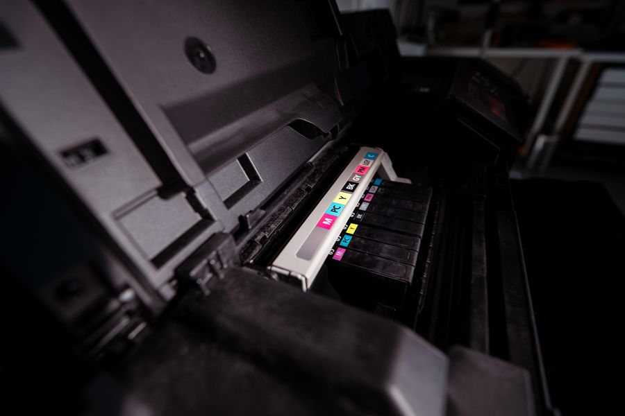 Toner cartridge being fitted inside a laser printer
