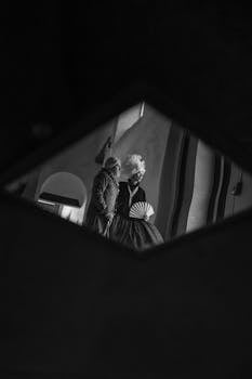 Black and white reflection of a couple in traditional clothing, Mexico City.
