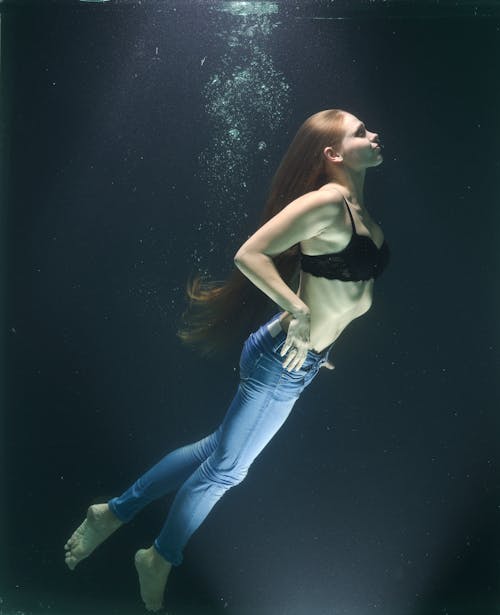 Free Woman in Body of Water Stock Photo