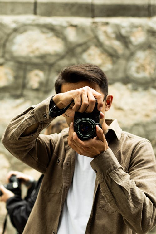 A man taking a picture with his camera
