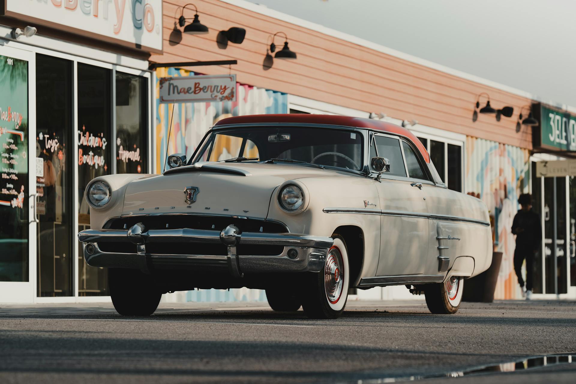 Vintage Mercury Monterey car parked outside shops on a sunny day in Wesley Chapel, FL.