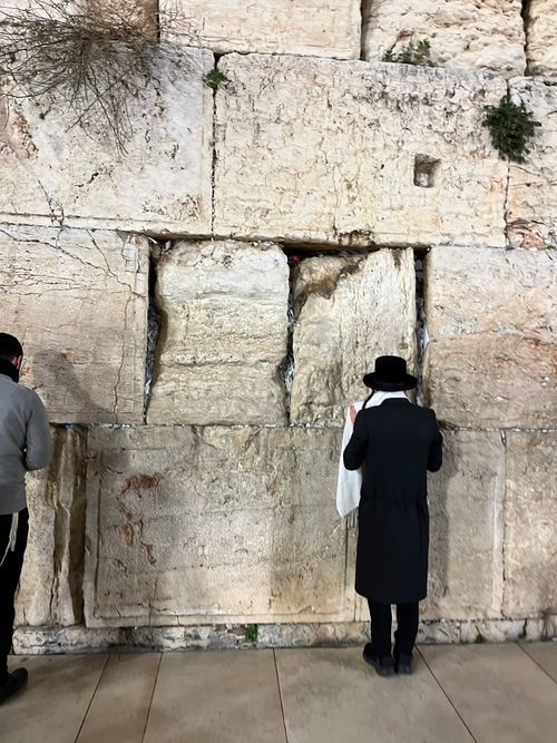 Free People praying at the Western Wall in Jerusalem, a significant Jewish religious site. Stock Photo