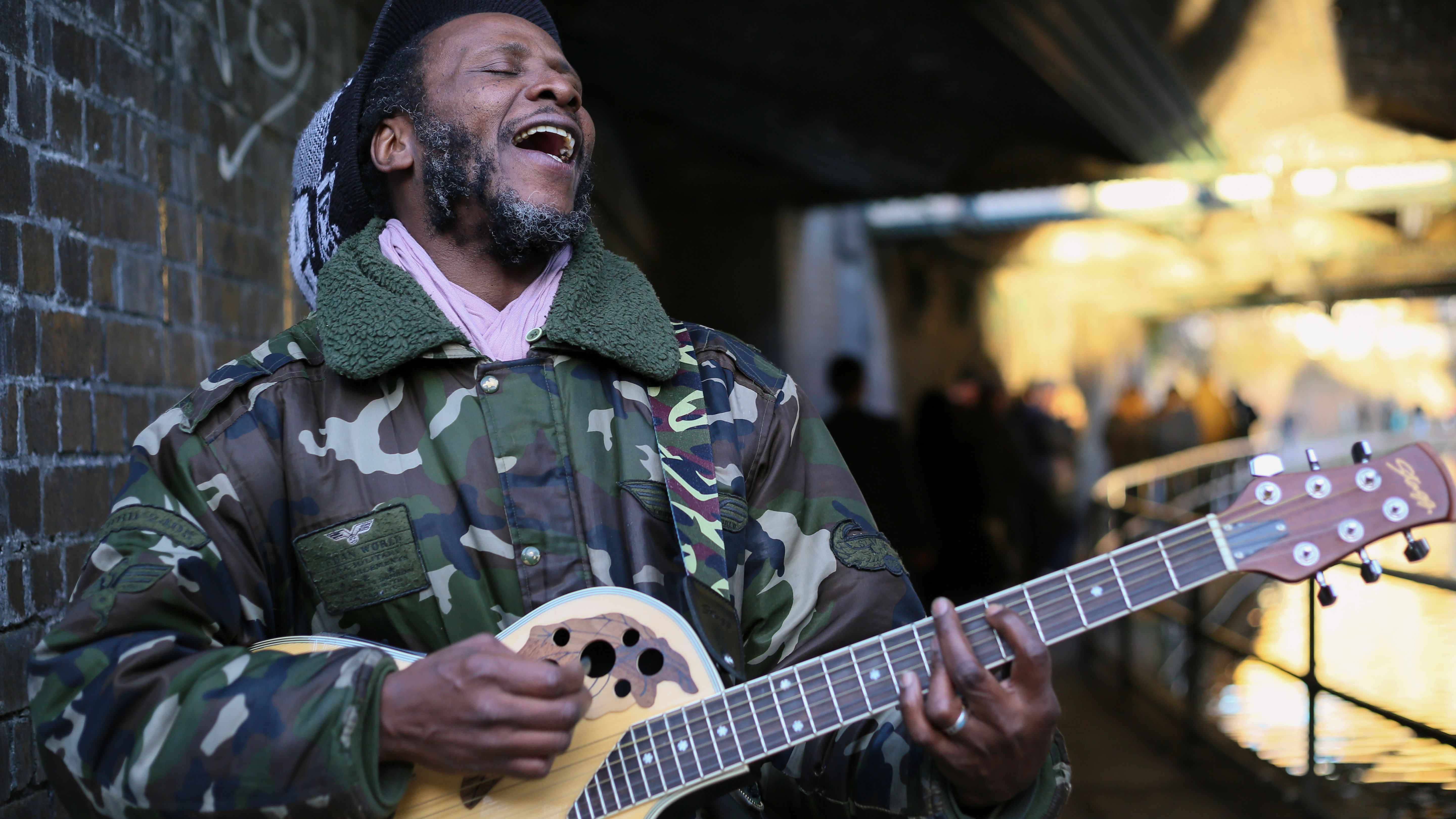 Man Playing on Guitar on a Street · Free Stock Photo