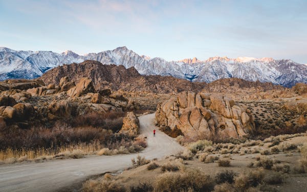 Hikers on mountain trail with breathtaking valley view