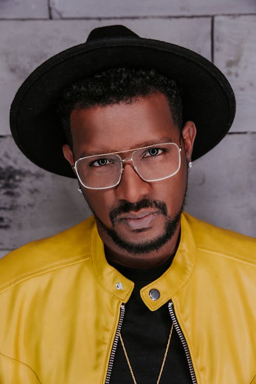 Man In Yellow Leather Jacket And Eyeglasses