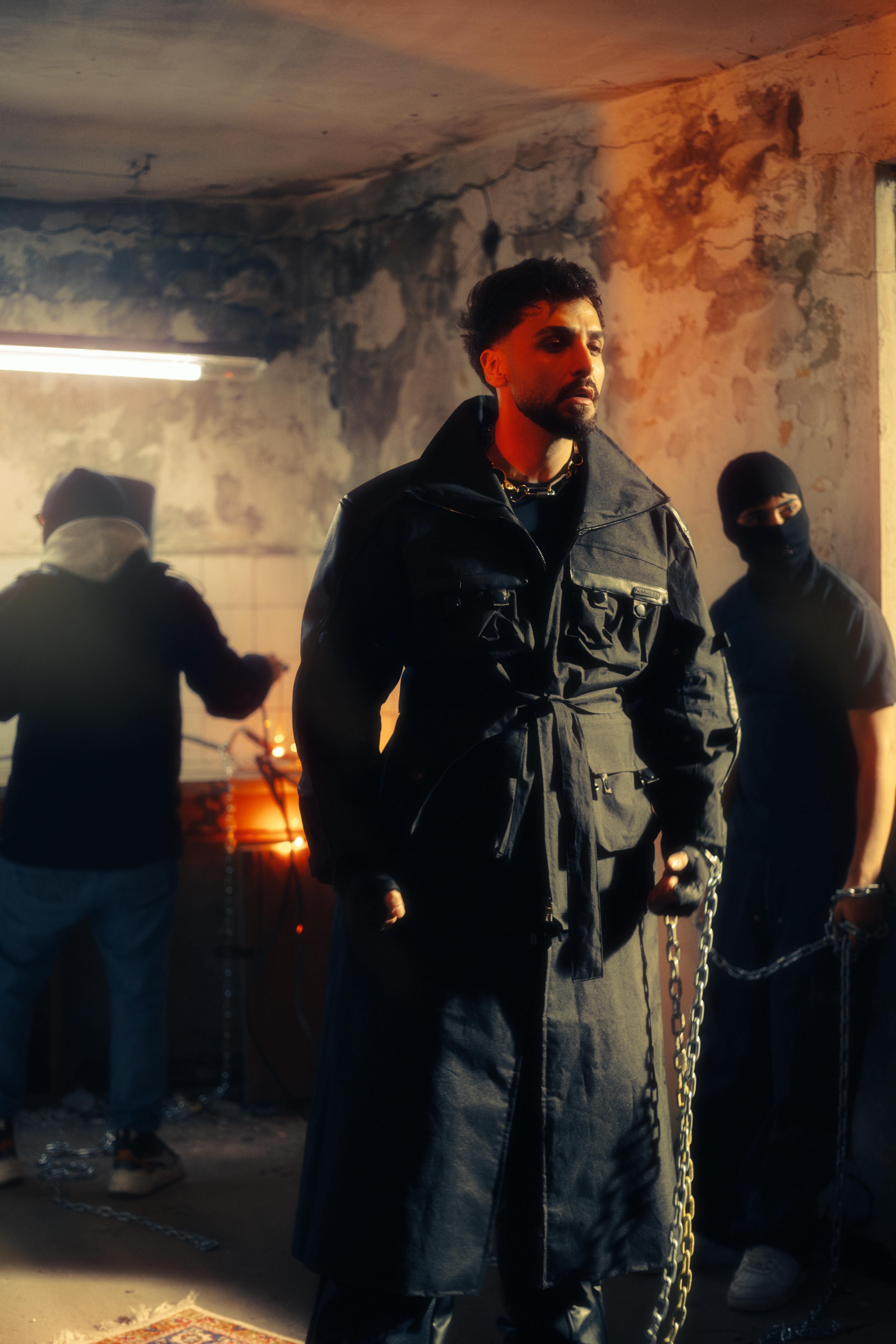 Three men in an abandoned building, dramatic lighting and urban style.