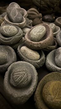 Close-up of intricately carved stone art pieces in Villa de Leyva, Colombia.