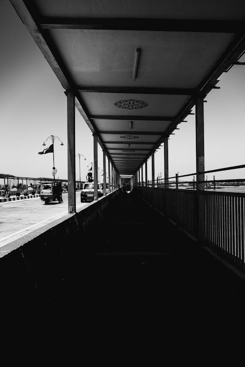 A black and white photo of a walkway