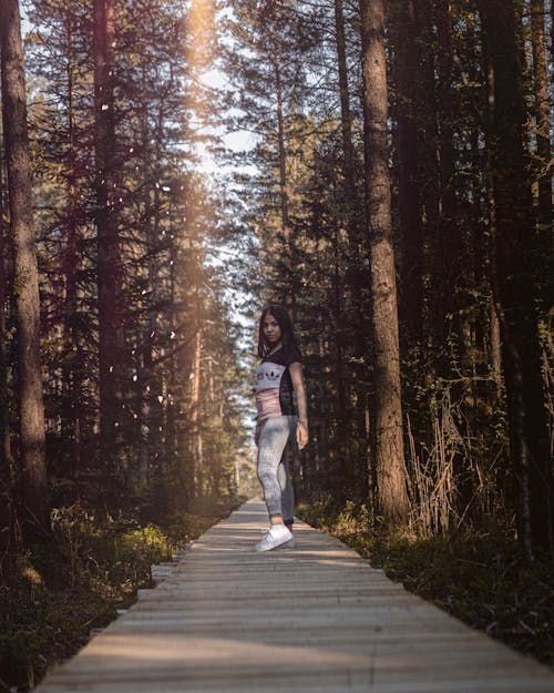 Woman Standing Near Trees