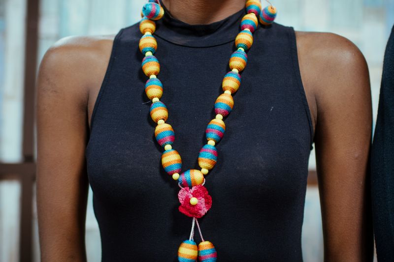 Vibrant beaded necklace close-up, reference style