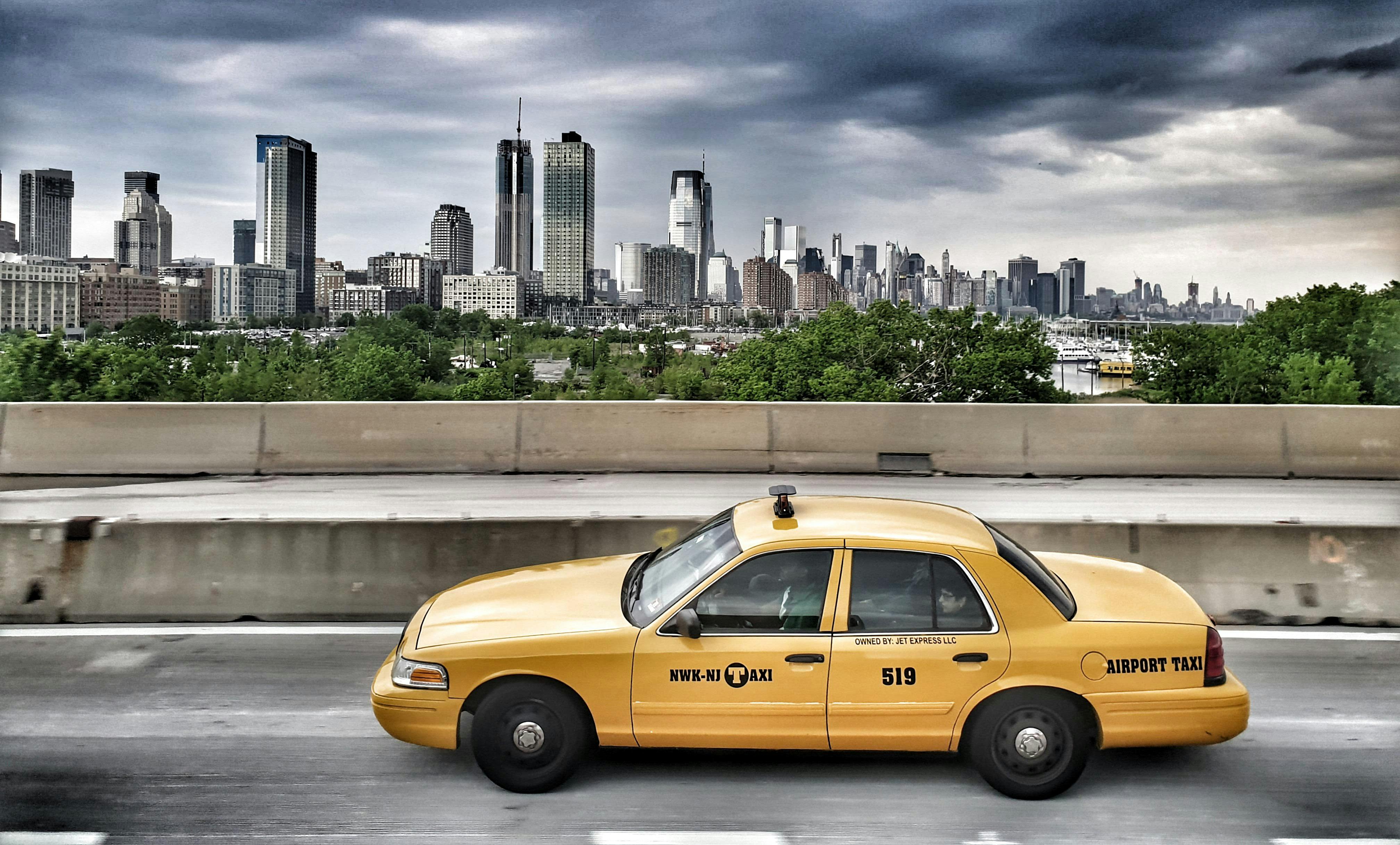 Taxi Passing Through The City \u00b7 Free Stock Photo