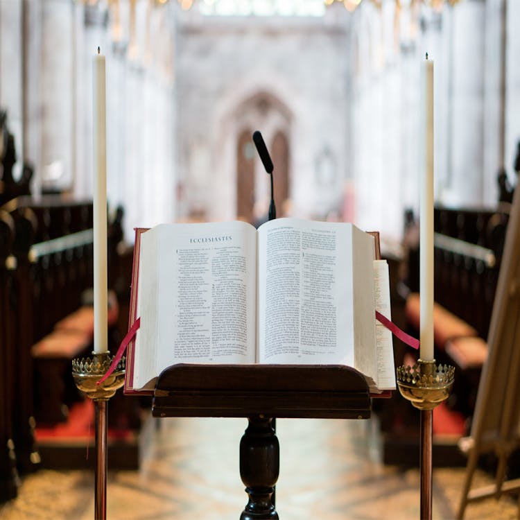 Bible on Stand Between Candles Inside Hall