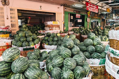 A market with watermelons and baskets of them