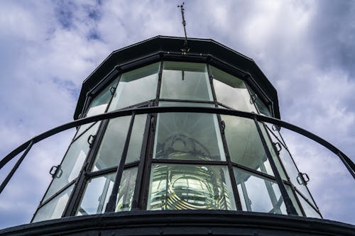 A close up view of a lighthouse with a glass dome