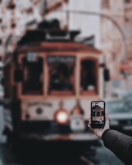 Person Taking A Photo Of A Train