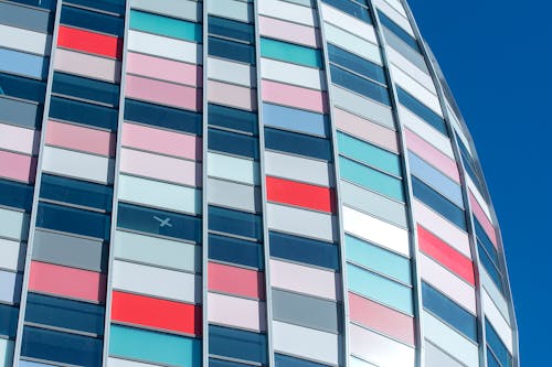 A building with many colored windows against a blue sky