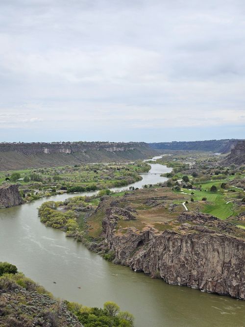 Free A breathtaking aerial view of Snake River winding through the cliffs and valleys of Idaho. Stock Photo