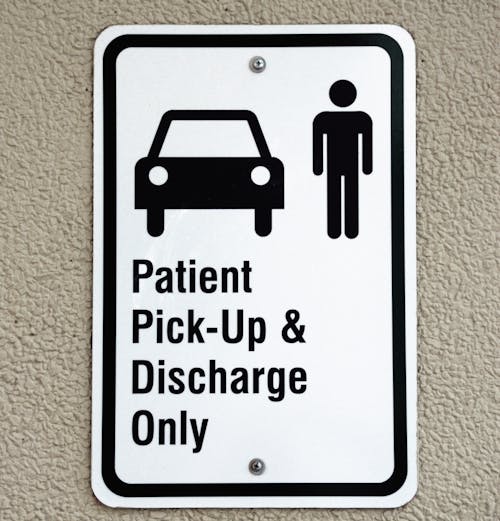 Free Patient Pick-up & Discharge Only Signage Stock Photo