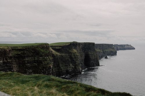 Free A breathtaking view of the Cliffs of Moher with dramatic coastal landscape and ocean view. Stock Photo