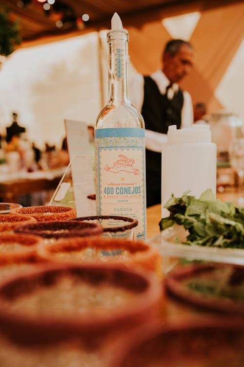 A bottle of tequila is sitting on a table