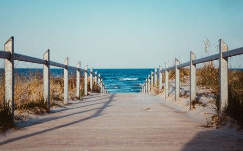 Free A serene wooden pathway leads to the picturesque Binz beach, perfect for a summer escape. Stock Photo