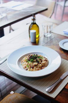 Close-up of flavorful risotto served in a restaurant setting, perfect for a gourmet meal.