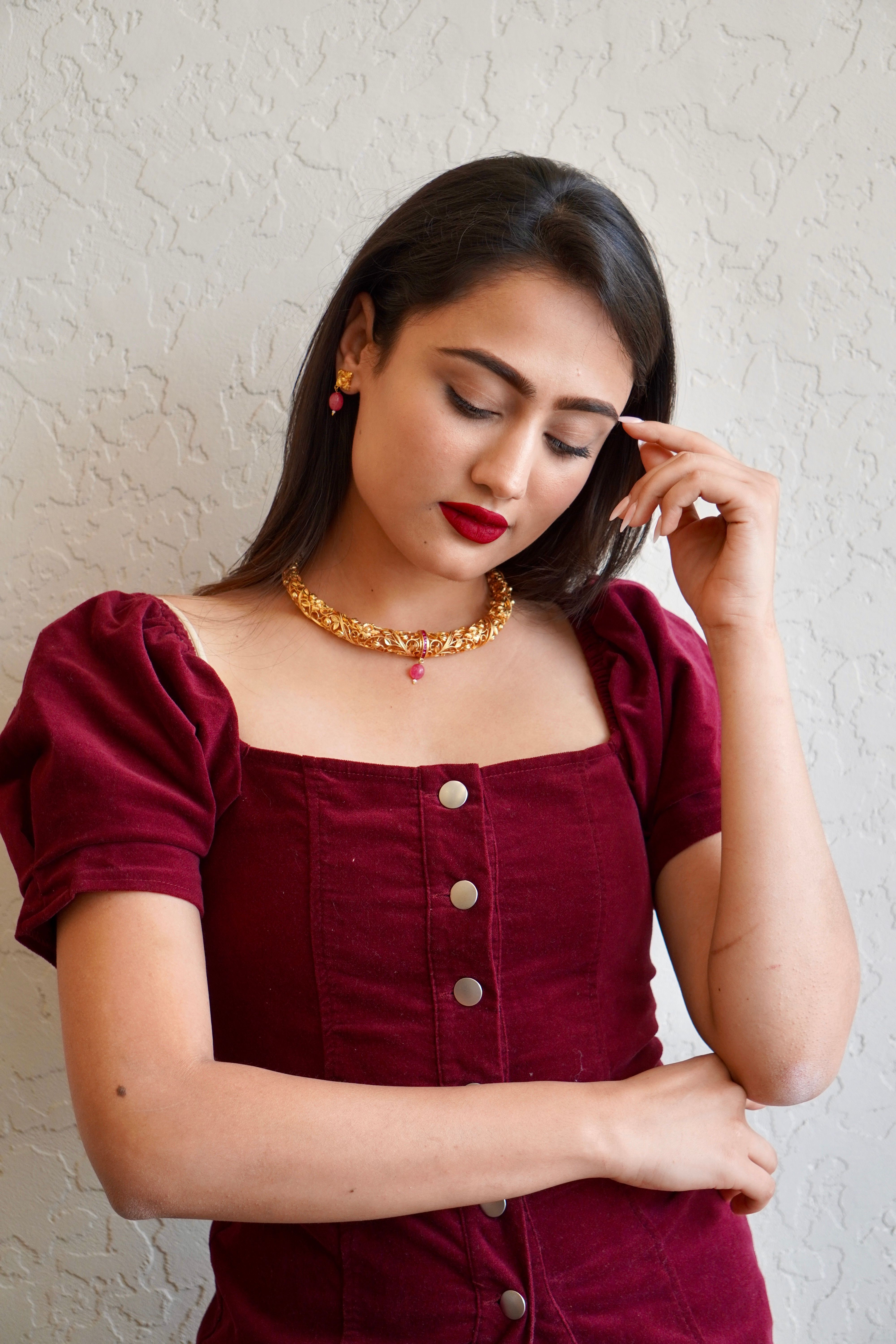 Woman in Burgundy Dress and Gold Necklace  Free Stock Photo