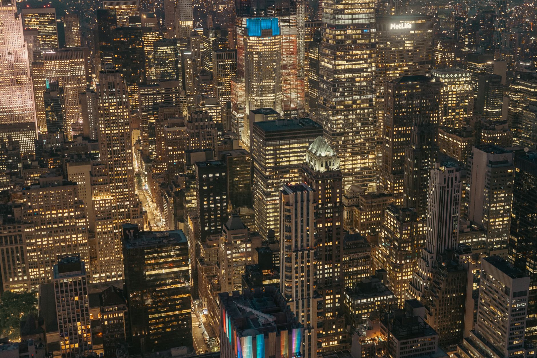 A stunning aerial view of New York City's illuminated skyline at night.