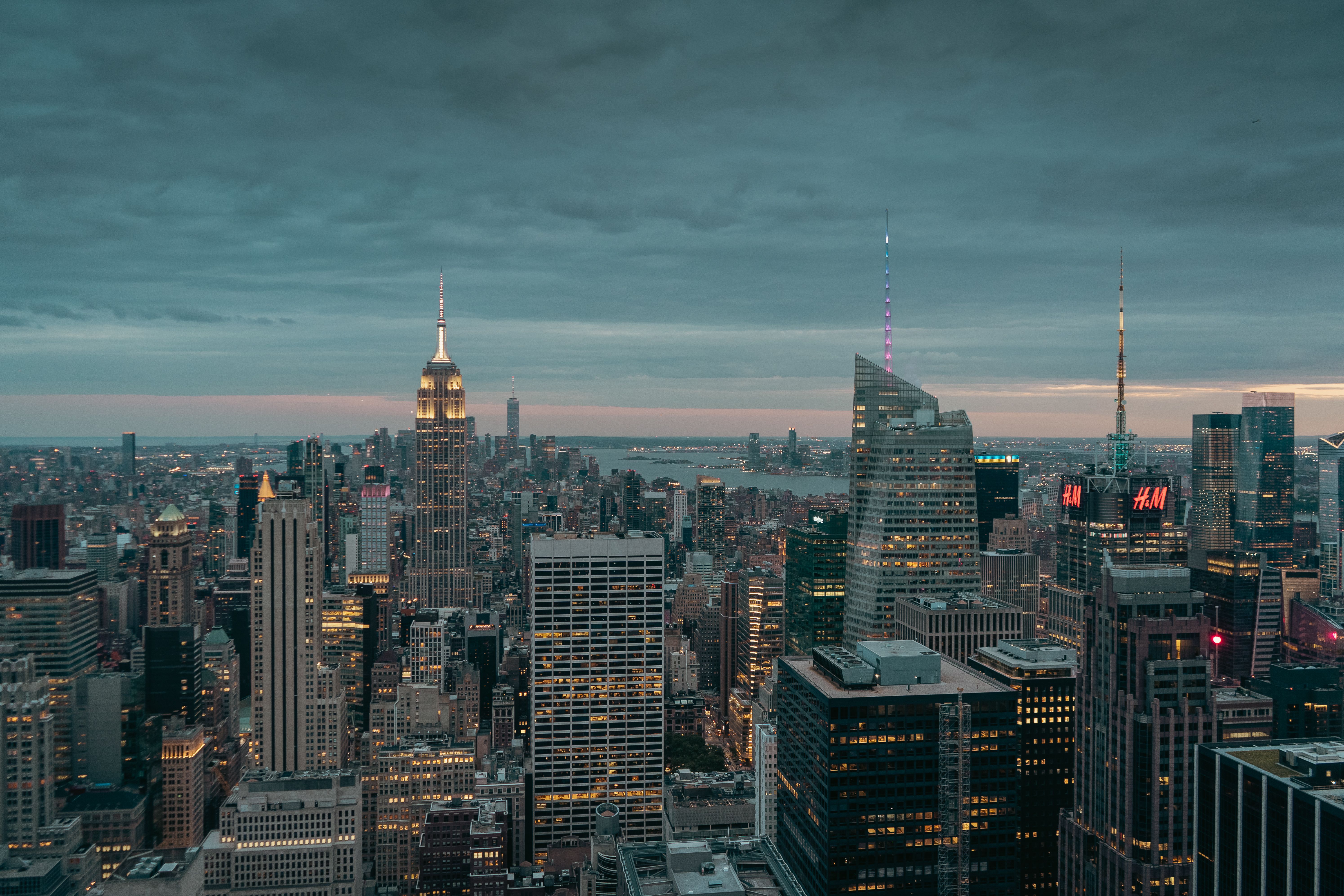 Stunning view of New York City skyline at twilight featuring iconic skyscrapers.