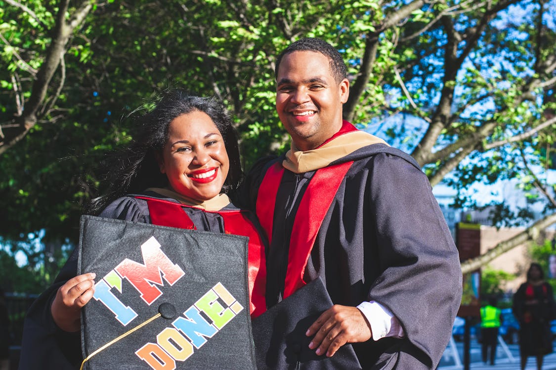Smiling Man and Woman Beside Trees