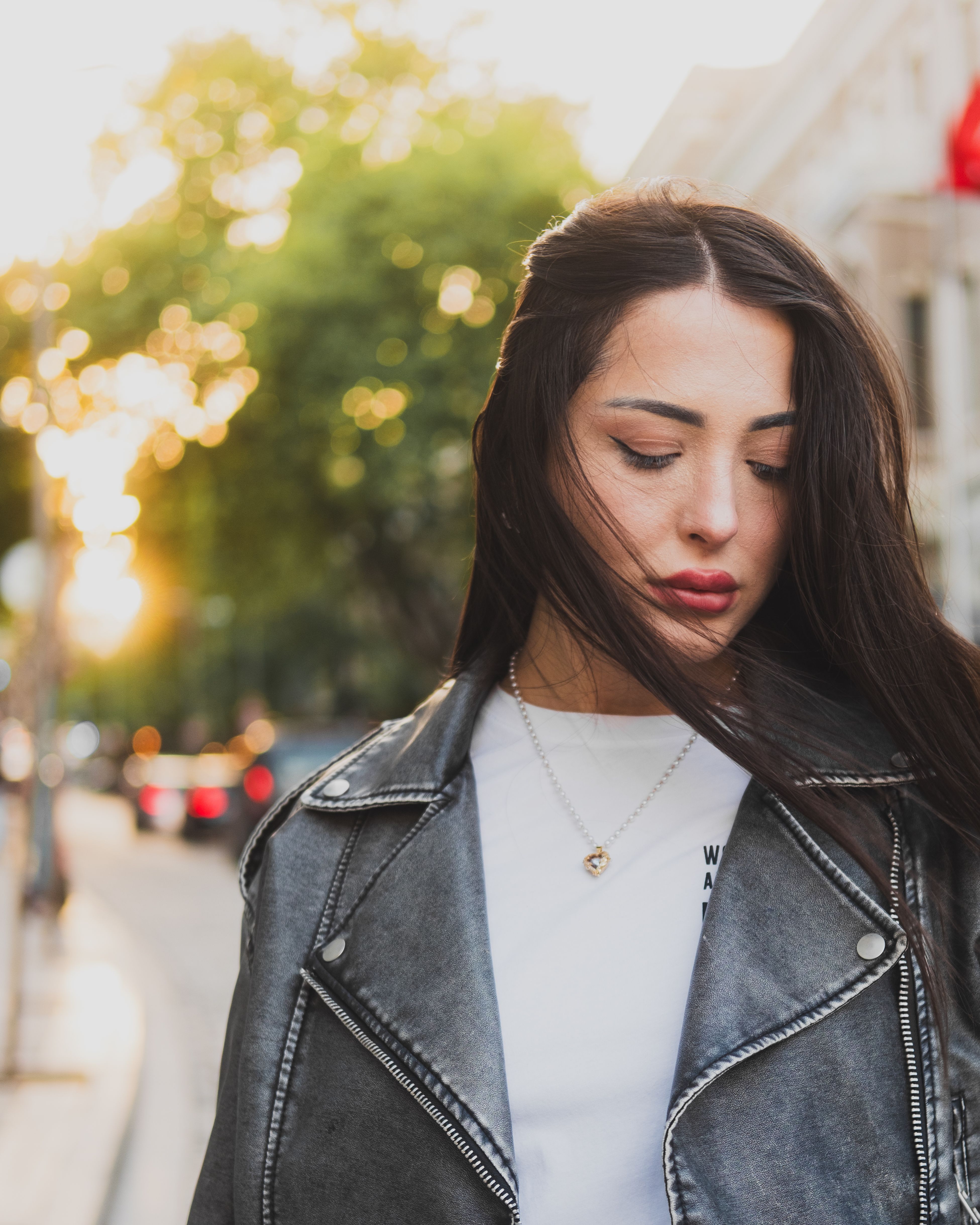 Photo of a Young Brunette in a Leather Jacket · Free Stock Photo