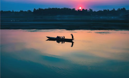 People Riding On Boat