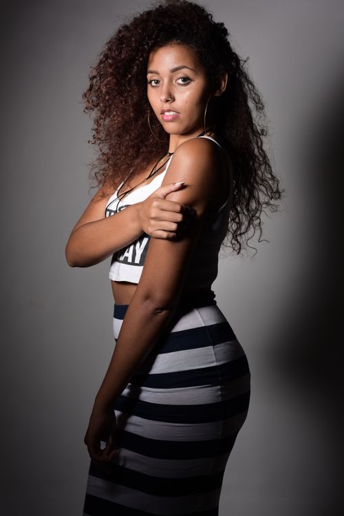 A Woman in a Crop Top and a Skirt · Free Stock Photo