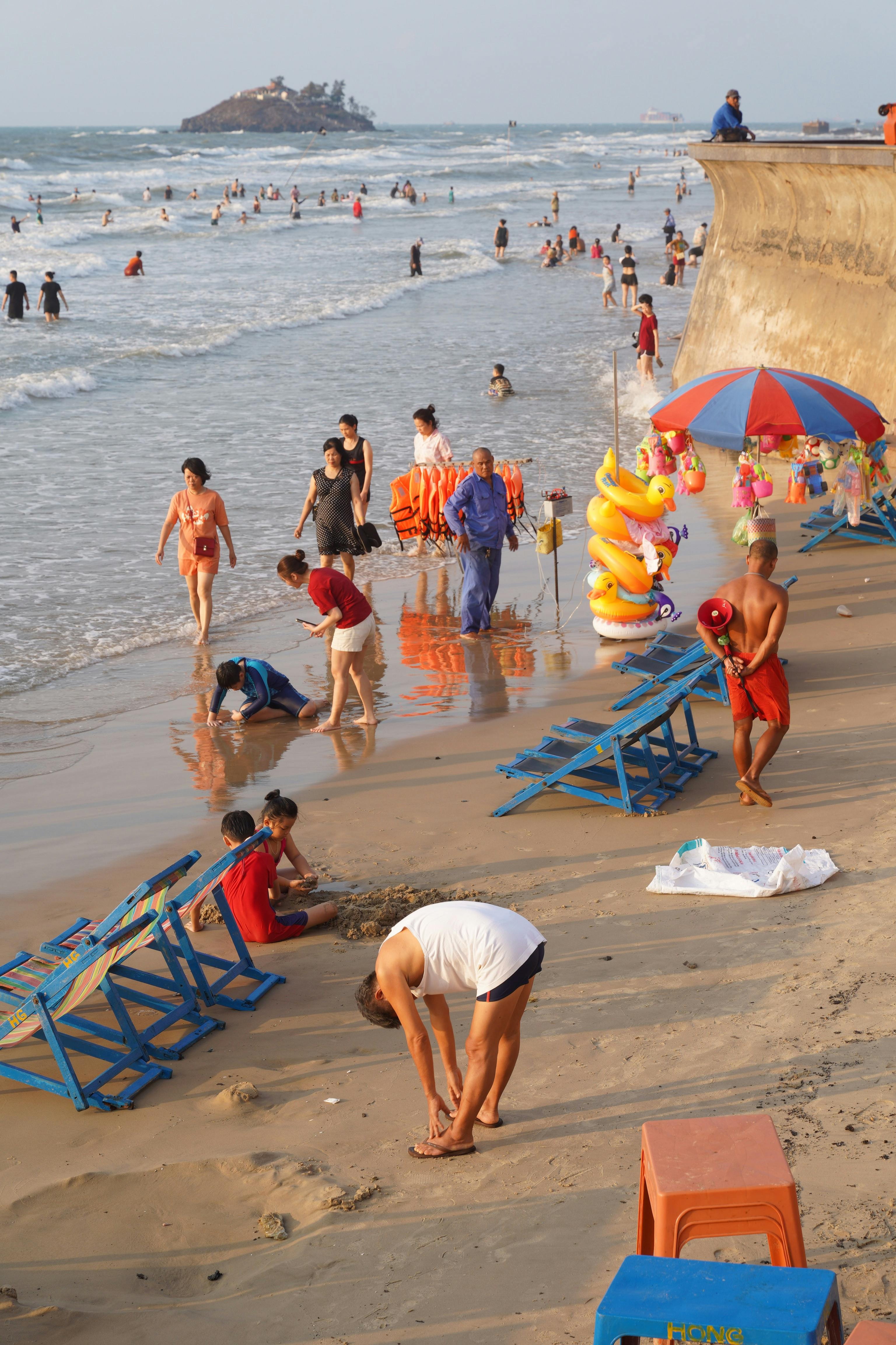 Crowded beach in Bà Rịa - Vũng Tàu, showcasing vibrant summer activities.