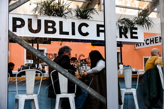 People socializing in a modern New York cafe with a trendy interior design.