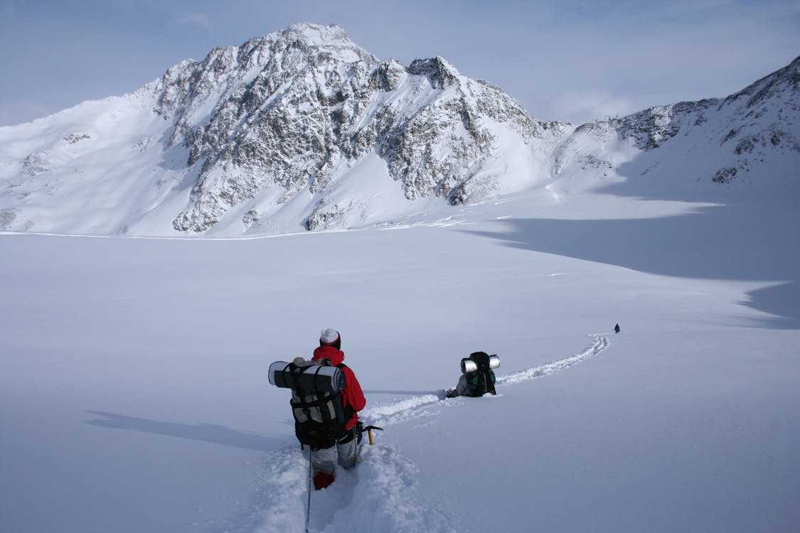 Free Man Walking on Alps Mountain Stock Photo