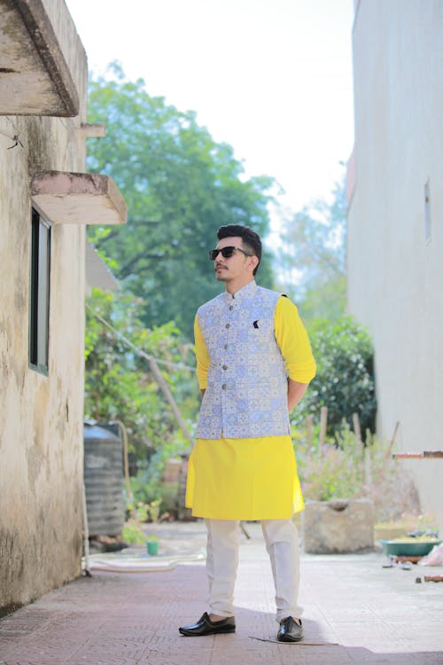 a man wearing kurta and looking up