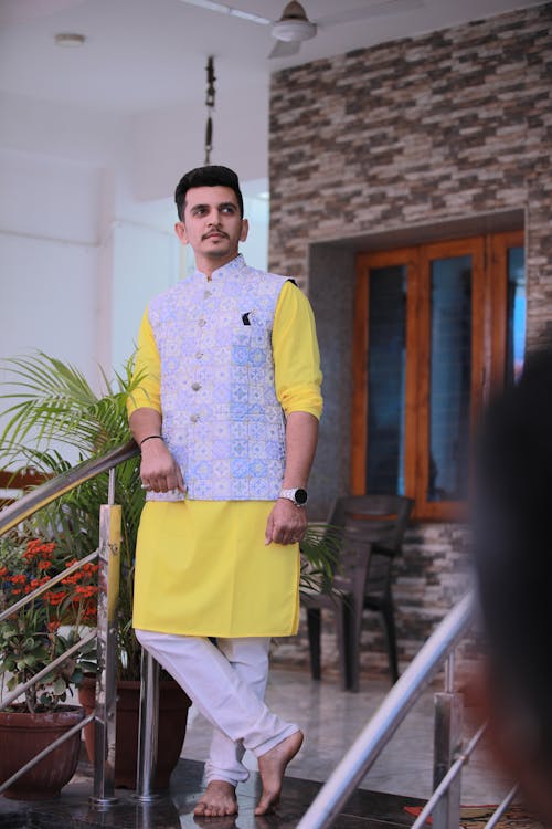 a man wearing kurta and looking 