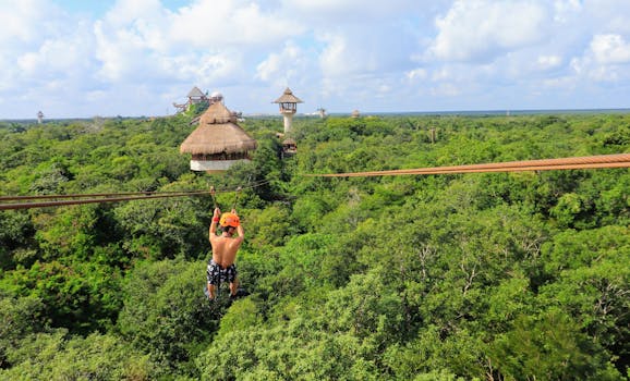 Thrilling ziplining adventure over lush forest at Xplor Park, Playa del Carmen.