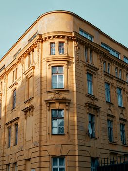 Captivating vintage architecture of a yellow building in Bratislava's urban landscape.