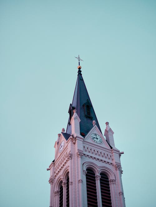 A church steeple with a clock on top