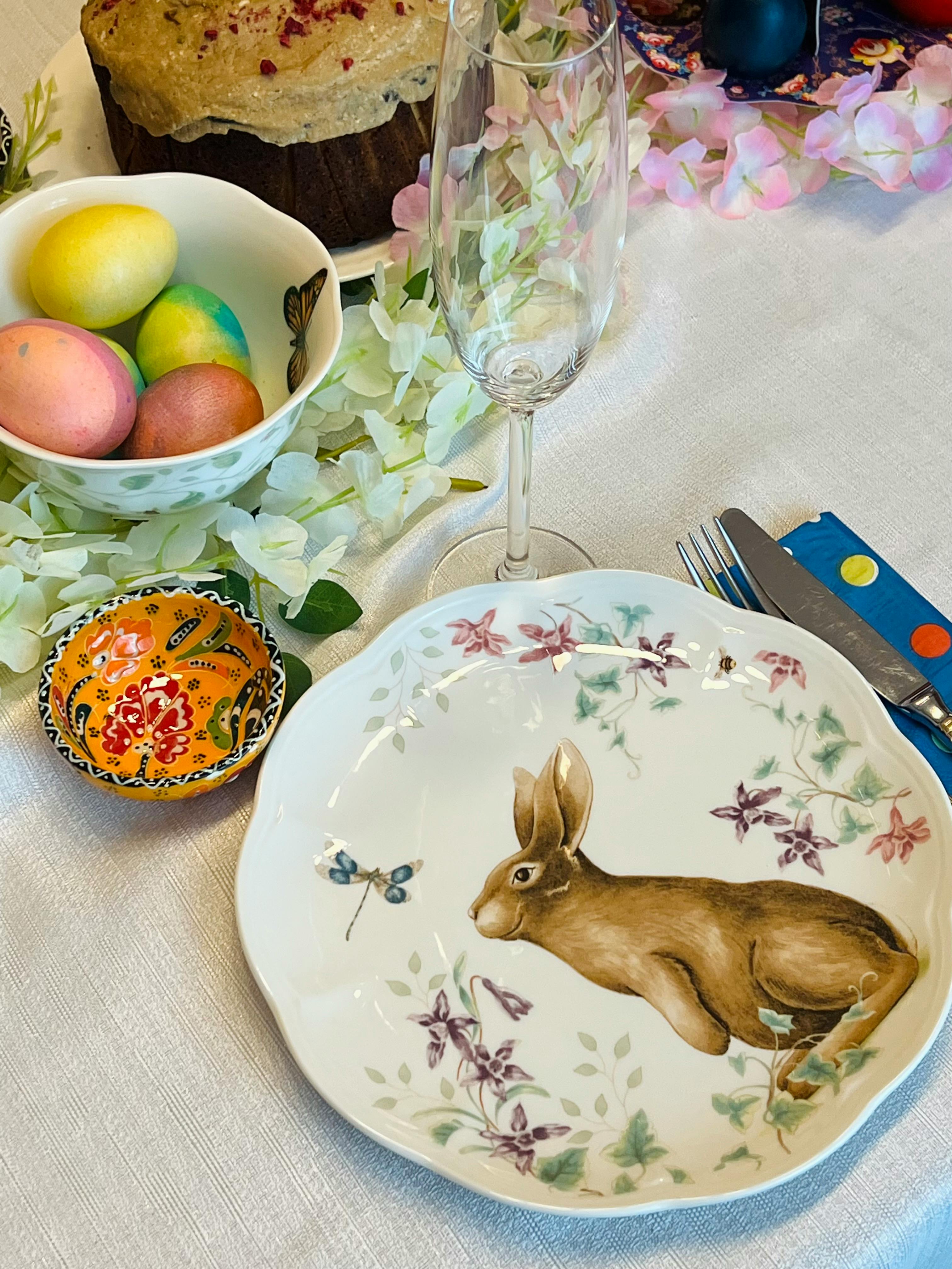 painted easter eggs and a plate with a rabbit illustration