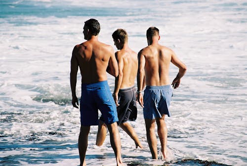 Free Unknown Persons Enjoying on Beach Stock Photo