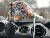 Pair of Multicolored Mid-rise Shoes on Black Car Air Vents