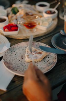 Close-up of a dessert plate with syrup and garnish, perfect for culinary presentations.