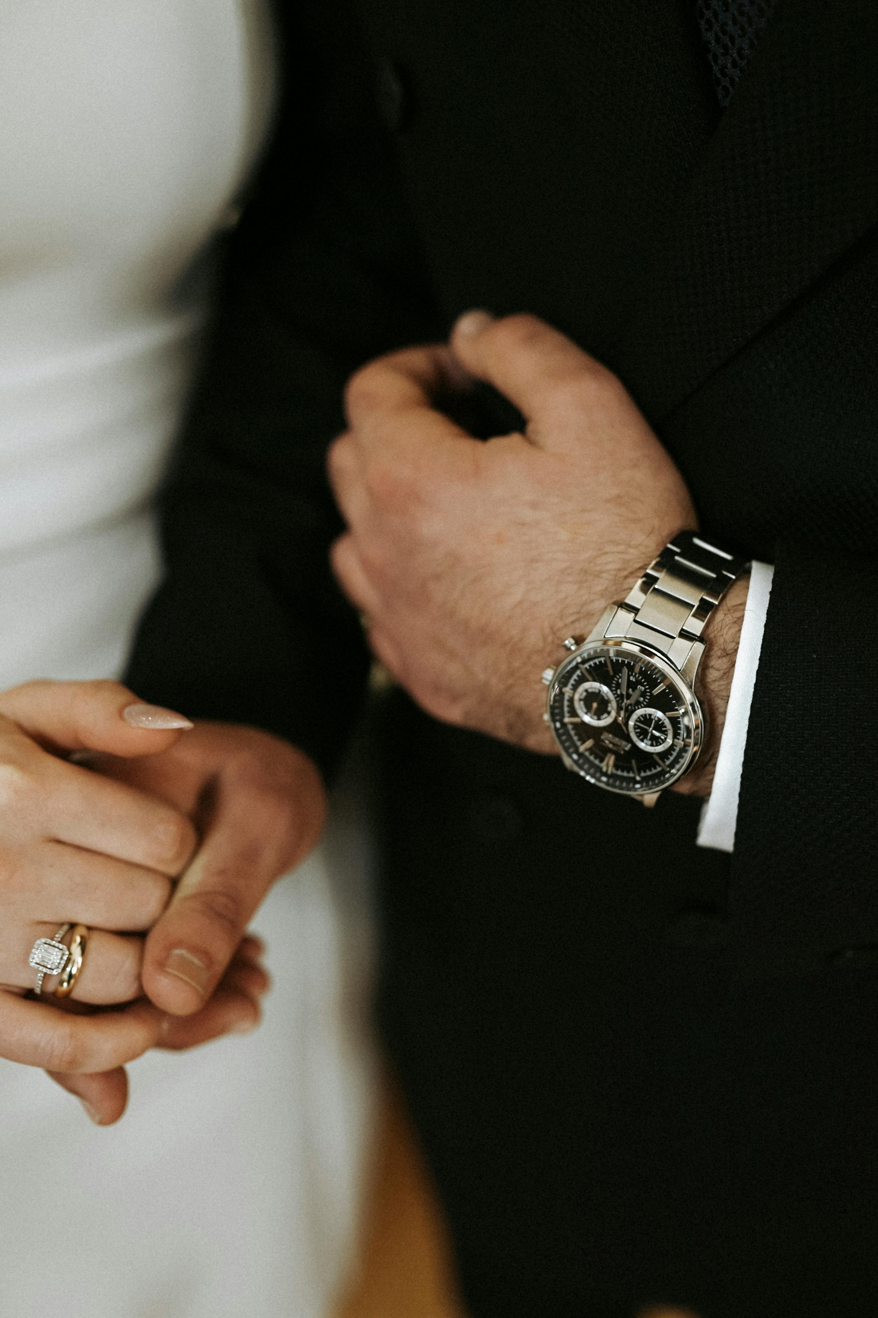 man wearing golden watch