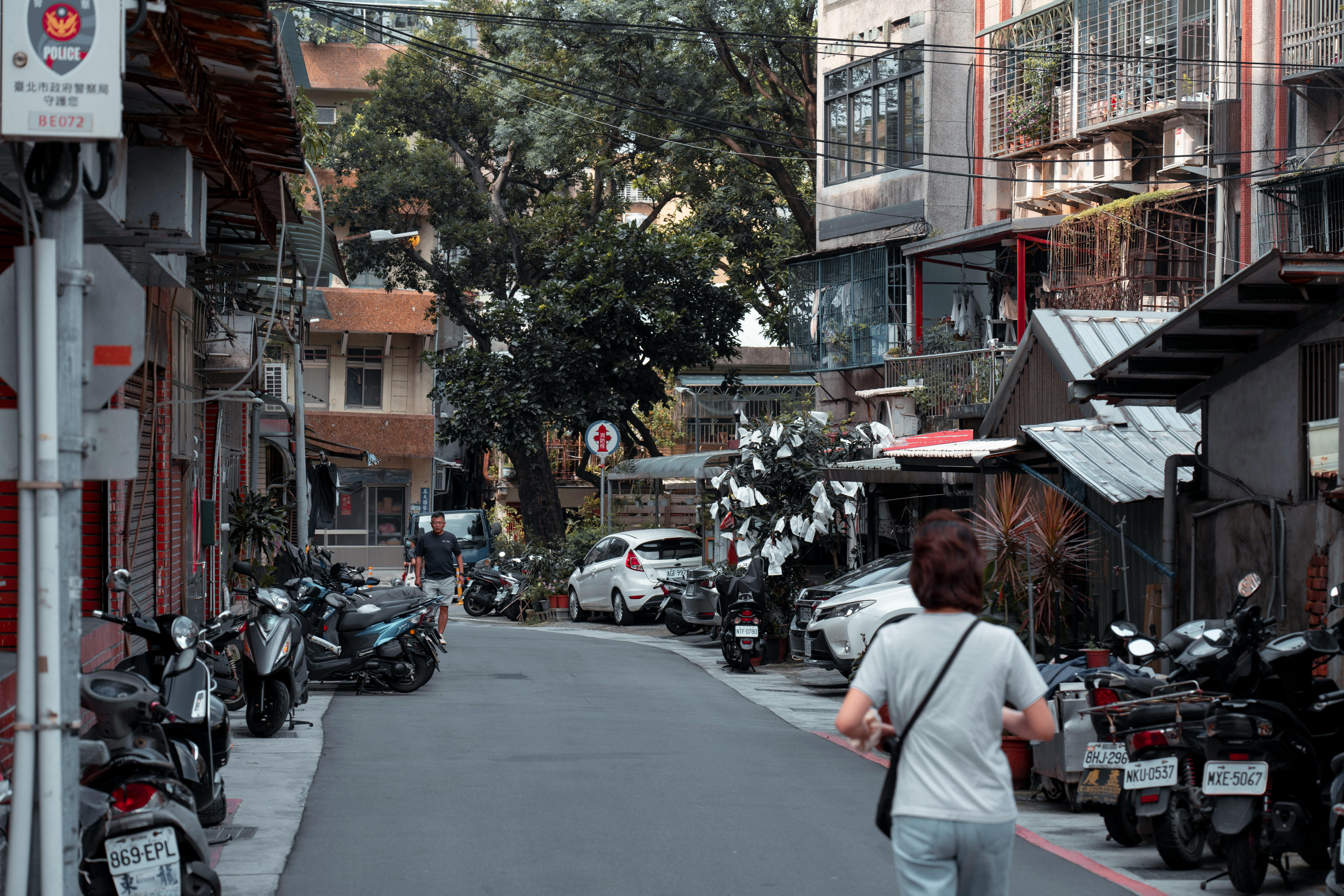 People Walking And Biking In A Neighborhood