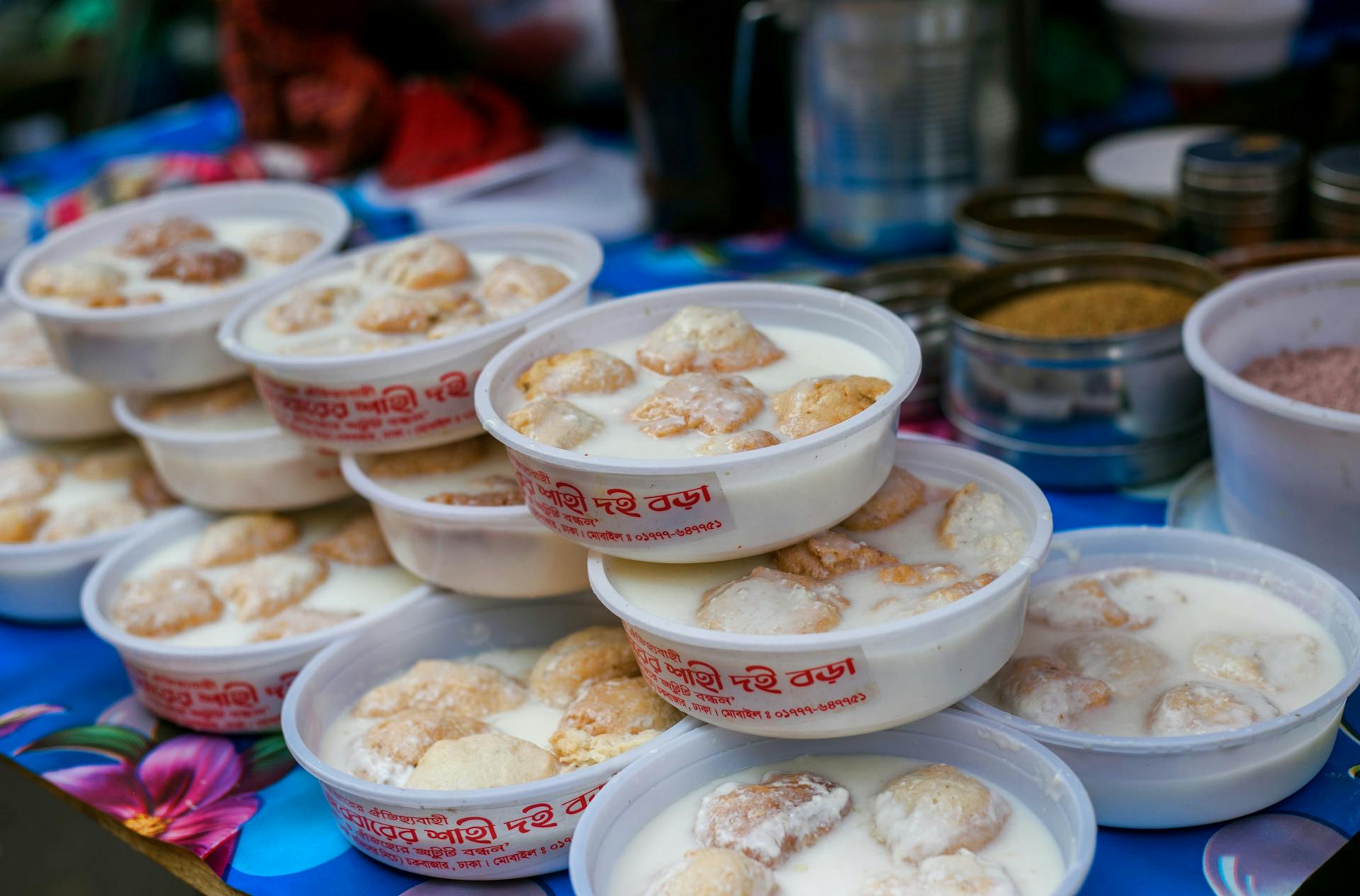 Authentic Bangladeshi Dudhi Vada served in street markets, showcasing rich flavors and cultural essence.